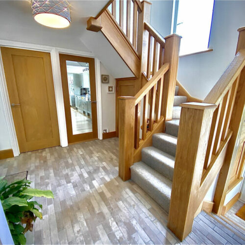 Oak staircase in modern house entrance